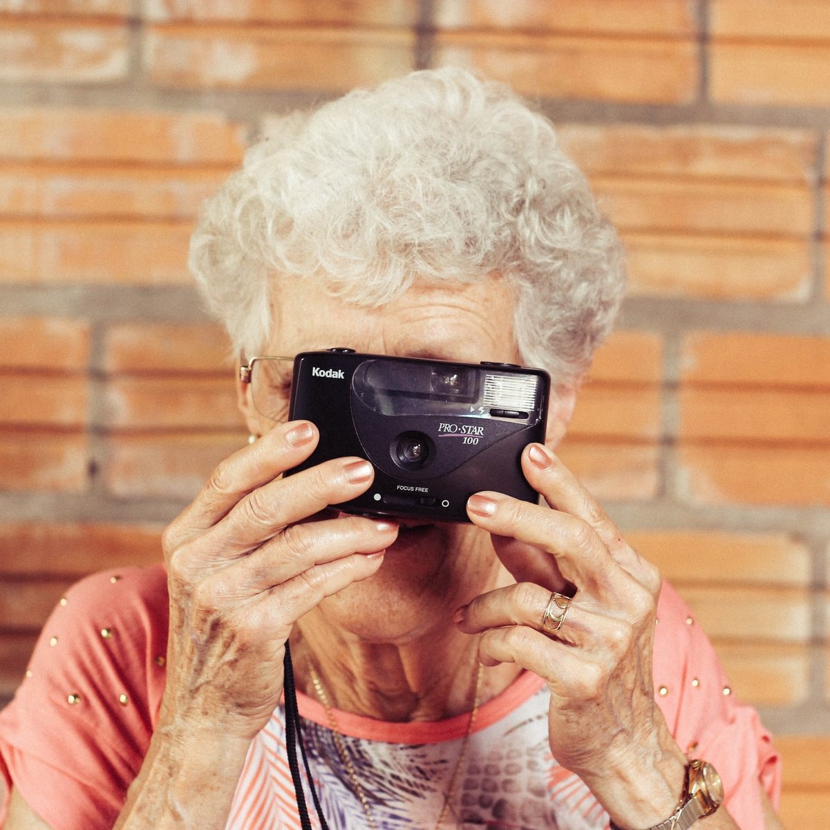 woman holding film camera